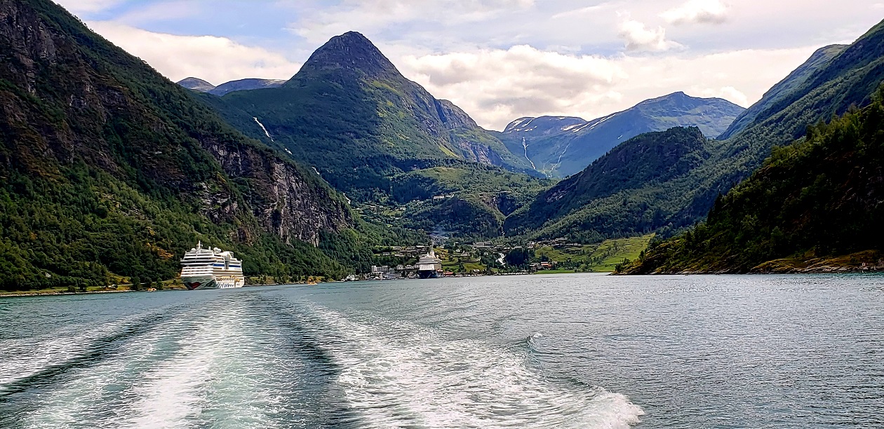 Out on the water for a fjord cruise – looking back at Geiranger